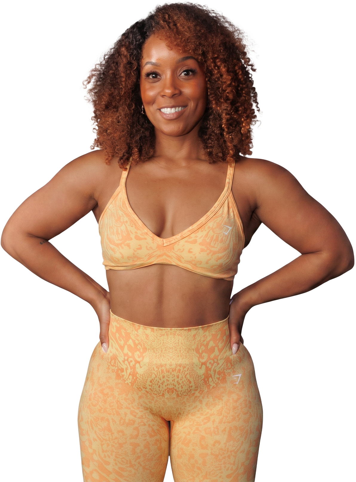 Jelisa, founder of the Fine As A Motha Collective, standing confidently in bright activewear